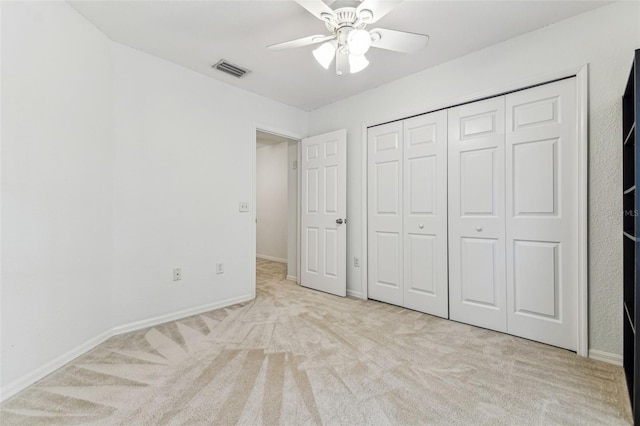 1624 Lullwater Ln, Lutz, FL 33549 - unfurnished bedroom with carpet floors, a closet, baseboards, and a ceiling fan