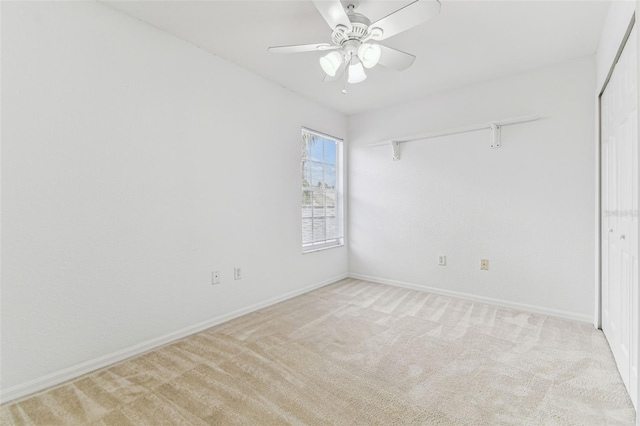 1624 Lullwater Ln, Lutz, FL 33549 - spare room with light colored carpet, ceiling fan, and baseboards