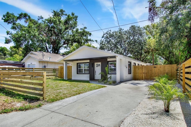 8603 N 9th St, Tampa, FL 33604 - view of front of house featuring driveway and stucco siding