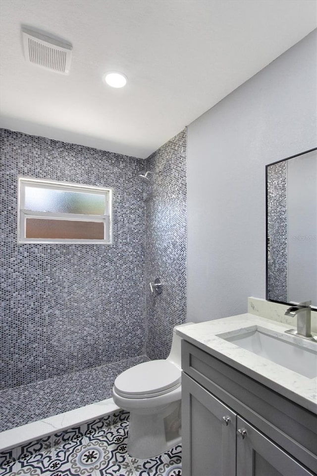 8603 N 9th St, Tampa, FL 33604 - bathroom with a stall shower, toilet, vanity, and tile patterned floors