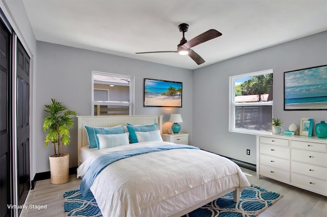 8603 N 9th St, Tampa, FL 33604 - bedroom featuring a closet, light wood-style flooring, and a ceiling fan