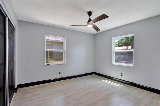 8603 N 9th St, Tampa, FL 33604 - empty room with ceiling fan, light wood-type flooring, and baseboards