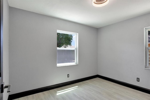 8603 N 9th St, Tampa, FL 33604 - empty room featuring light wood finished floors and baseboards