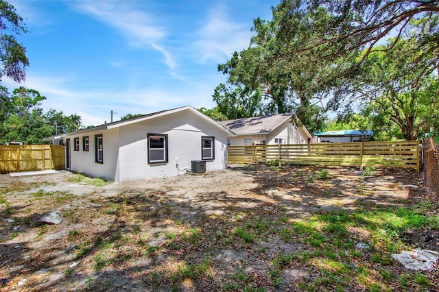 8603 N 9th St, Tampa, FL 33604 - rear view of house featuring a fenced backyard, stucco siding, and cooling unit