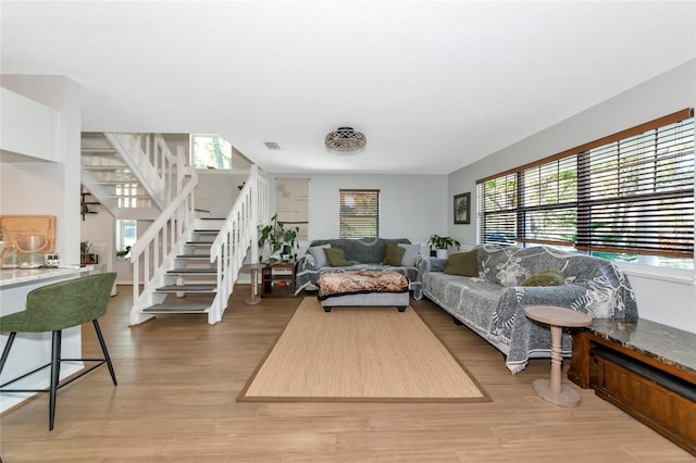 2311 64th Street Ct W, Bradenton, FL 34209 - living room featuring stairway and light wood-style floors