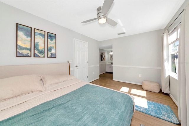 2311 64th Street Ct W, Bradenton, FL 34209 - bedroom with wood finished floors, baseboards, and ceiling fan