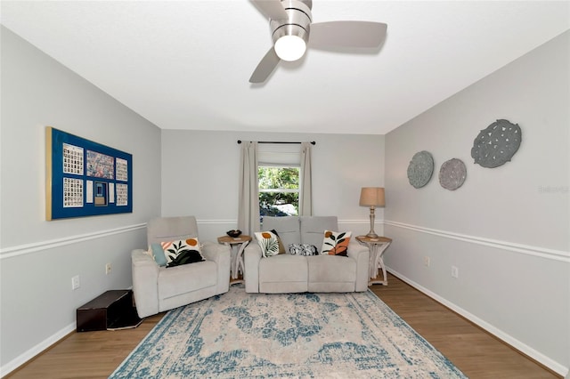 2311 64th Street Ct W, Bradenton, FL 34209 - living area featuring wood finished floors, ceiling fan, and baseboards