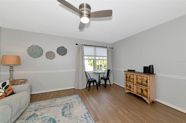 2311 64th Street Ct W, Bradenton, FL 34209 - sitting room featuring wood finished floors, a ceiling fan, and baseboards