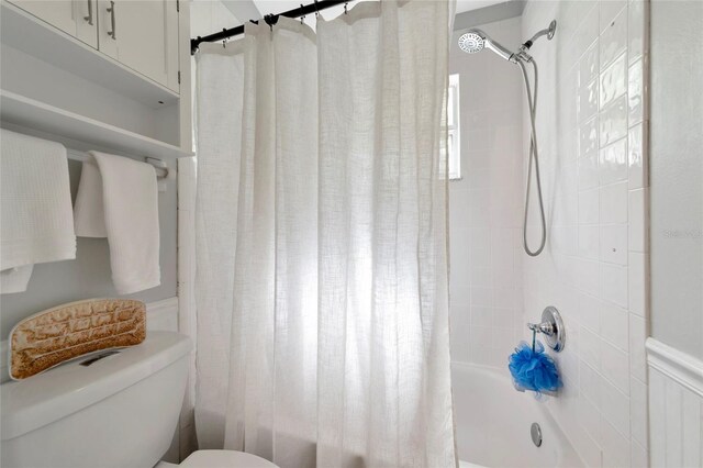2311 64th Street Ct W, Bradenton, FL 34209 - bathroom featuring shower / bath combination with curtain and toilet