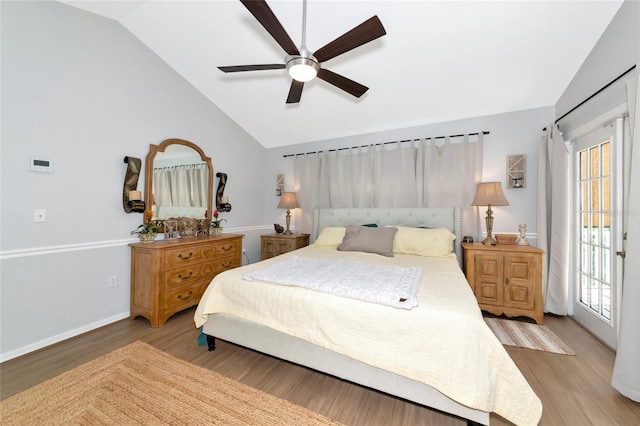 2311 64th Street Ct W, Bradenton, FL 34209 - bedroom with vaulted ceiling, wood finished floors, ceiling fan, access to exterior, and baseboards