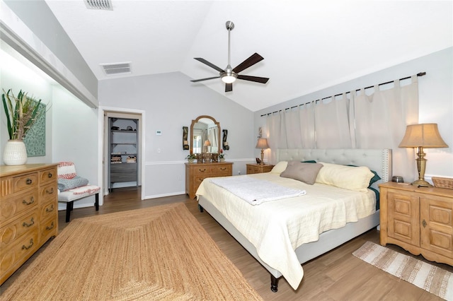 2311 64th Street Ct W, Bradenton, FL 34209 - bedroom with lofted ceiling, wood finished floors, and a ceiling fan
