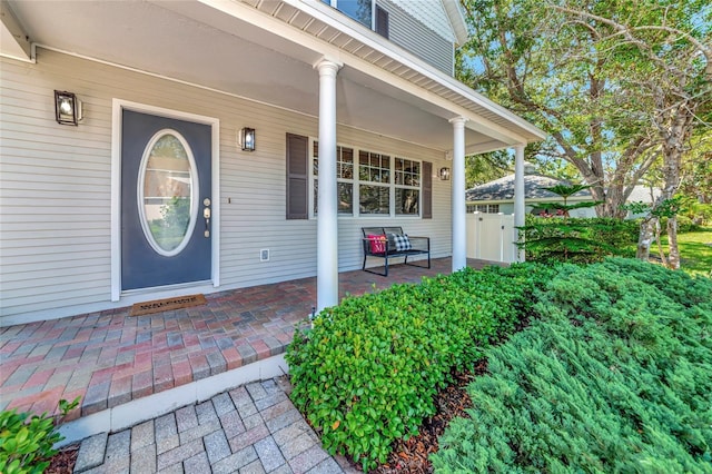2311 64th Street Ct W, Bradenton, FL 34209 - doorway to property featuring covered porch