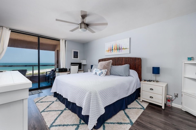 1310 Gulf Blvd Unit 6C, Clearwater Beach, FL 33767 - bedroom with access to outside, wood finished floors, baseboards, a ceiling fan, and a wall of windows