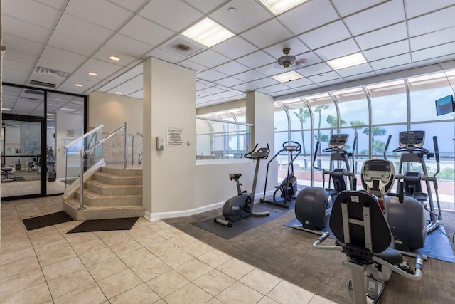 1310 Gulf Blvd Unit 6C, Clearwater Beach, FL 33767 - workout area featuring tile patterned flooring, baseboards, and expansive windows