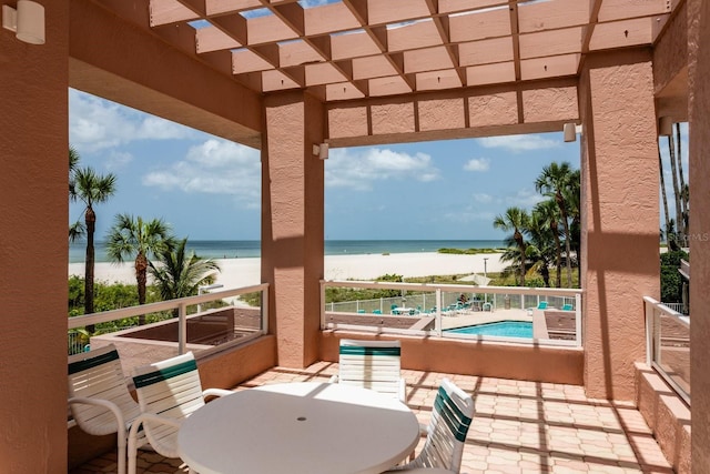 1310 Gulf Blvd Unit 6C, Clearwater Beach, FL 33767 - view of patio / terrace featuring view of water and beach, a community pool, and a balcony