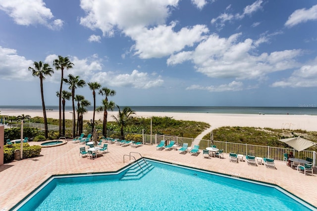 1310 Gulf Blvd Unit 6C, Clearwater Beach, FL 33767 - community pool featuring a patio, view of water and beach, and a community hot tub