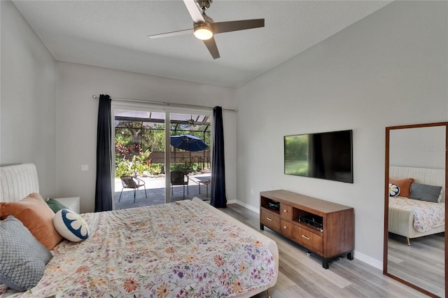 16367 Ashington Park Dr, Tampa, FL 33647 - bedroom with access to exterior, light wood finished floors, a ceiling fan, lofted ceiling, and baseboards