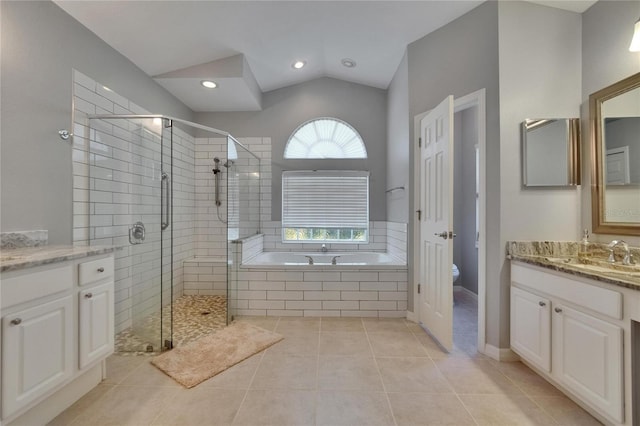 16367 Ashington Park Dr, Tampa, FL 33647 - bathroom with vanity, a stall shower, a garden tub, tile patterned floors, and lofted ceiling