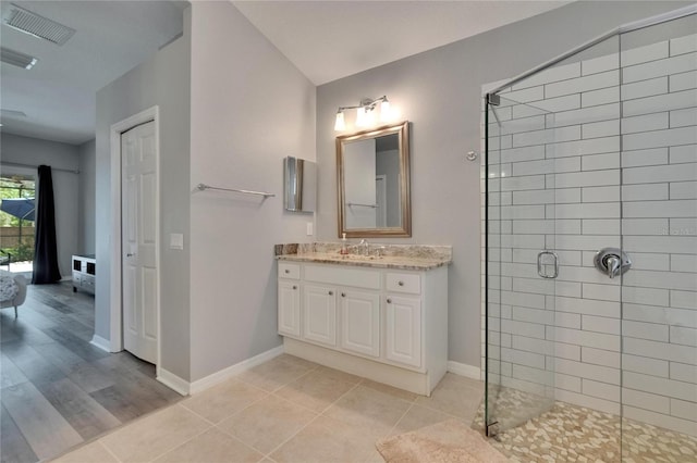 16367 Ashington Park Dr, Tampa, FL 33647 - full bath featuring a stall shower, vanity, baseboards, and tile patterned floors
