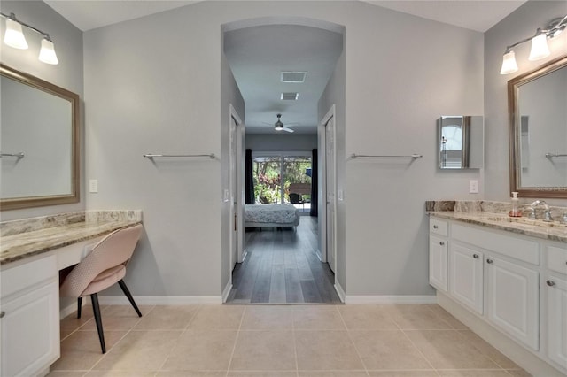16367 Ashington Park Dr, Tampa, FL 33647 - ensuite bathroom with vanity, a ceiling fan, baseboards, and tile patterned floors