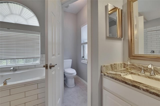 16367 Ashington Park Dr, Tampa, FL 33647 - bathroom with a bath, vanity, tile patterned floors, toilet, and baseboards