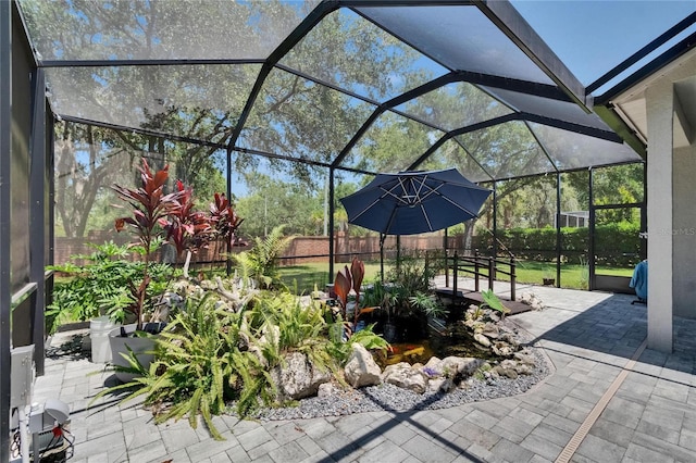 16367 Ashington Park Dr, Tampa, FL 33647 - fenced backyard featuring a patio area and glass enclosure