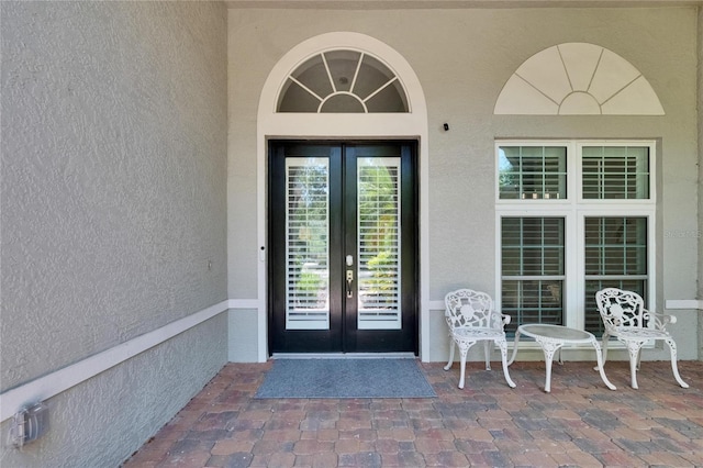 16367 Ashington Park Dr, Tampa, FL 33647 - property entrance featuring french doors and stucco siding