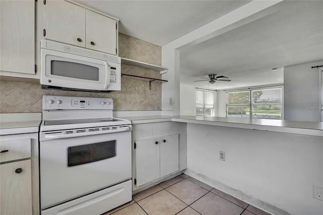 7810 Pineapple Ln, Port Richey, FL 34668 - kitchen featuring white appliances, light countertops, light tile patterned floors, a ceiling fan, and open shelves