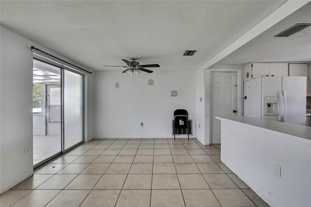 7810 Pineapple Ln, Port Richey, FL 34668 - unfurnished room with ceiling fan and a textured ceiling