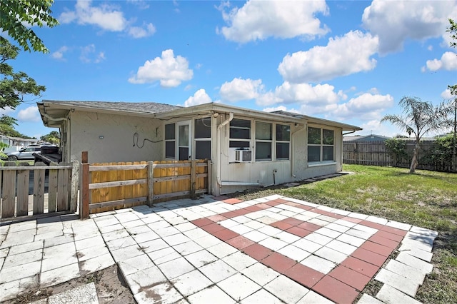 7810 Pineapple Ln, Port Richey, FL 34668 - rear view of house with a patio area and stucco siding