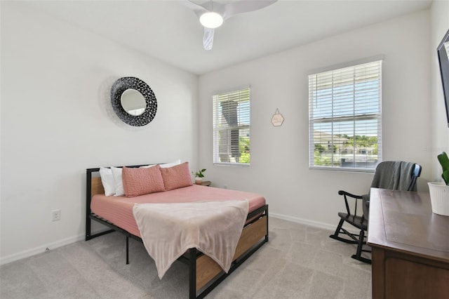 12517 Nantahala Run, Parrish, FL 34219 - bedroom with baseboards, light colored carpet, and ceiling fan