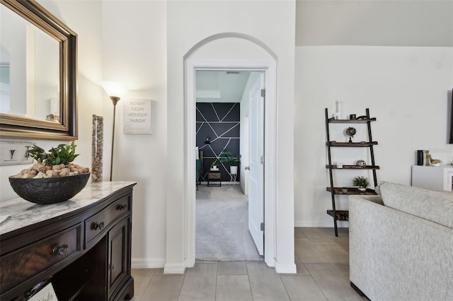 12517 Nantahala Run, Parrish, FL 34219 - hallway with light tile patterned flooring and baseboards