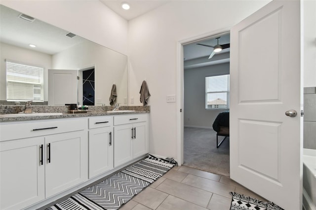12517 Nantahala Run, Parrish, FL 34219 - ensuite bathroom featuring double vanity and tile patterned floors