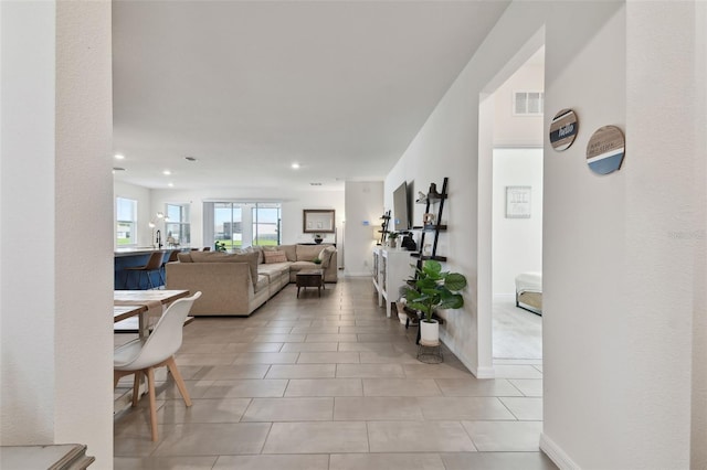 12517 Nantahala Run, Parrish, FL 34219 - living area featuring light tile patterned floors, recessed lighting, and baseboards