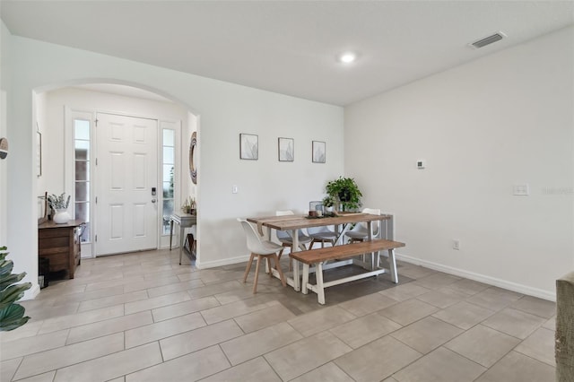 12517 Nantahala Run, Parrish, FL 34219 - dining space with arched walkways, baseboards, and recessed lighting
