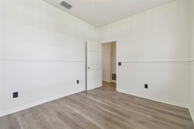 105 1st Ave SE, Lutz, FL 33549 - empty room featuring wood finished floors and baseboards