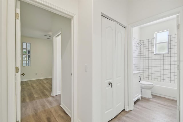 105 1st Ave SE, Lutz, FL 33549 - corridor featuring light wood-type flooring, healthy amount of natural light, and baseboards