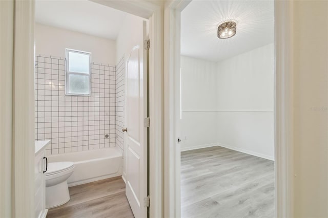 105 1st Ave SE, Lutz, FL 33549 - full bathroom with toilet, wood finished floors, vanity, and shower / bath combination