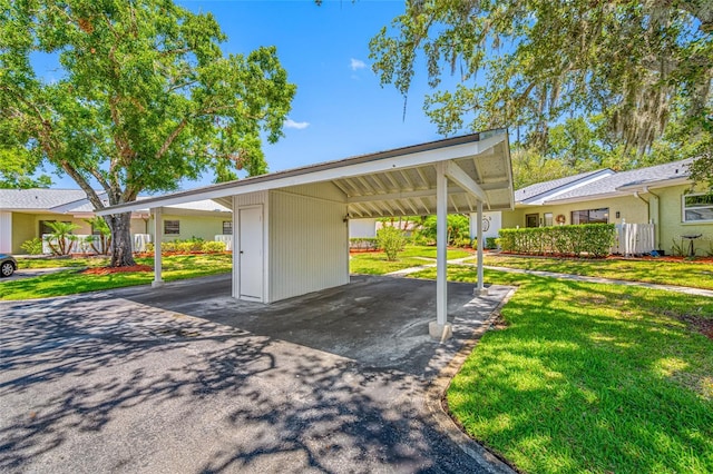 70 Cypress Pl, Oldsmar, FL 34677 - view of parking / parking lot with a carport