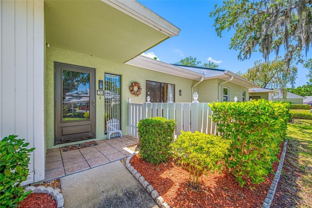 70 Cypress Pl, Oldsmar, FL 34677 - doorway to property with stucco siding