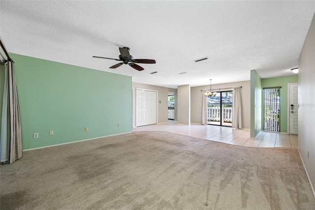 70 Cypress Pl, Oldsmar, FL 34677 - unfurnished room featuring light carpet, a chandelier, a ceiling fan, a textured ceiling, and baseboards