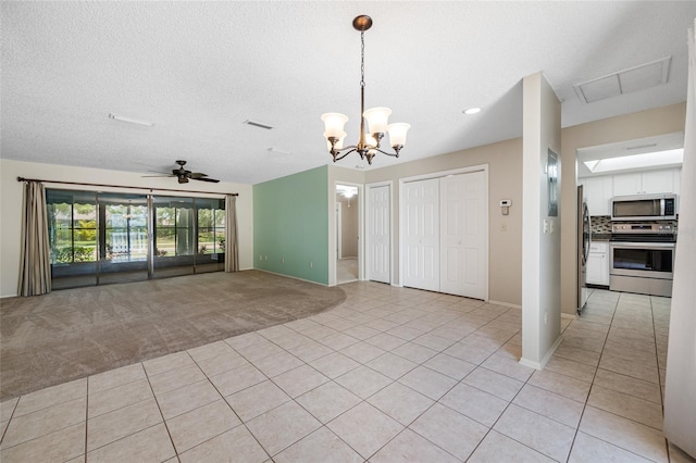 70 Cypress Pl, Oldsmar, FL 34677 - unfurnished living room with light tile patterned floors, light colored carpet, a chandelier, baseboards, and recessed lighting