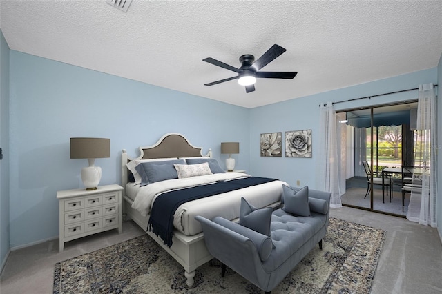70 Cypress Pl, Oldsmar, FL 34677 - bedroom with access to exterior, light colored carpet, a textured ceiling, a ceiling fan, and baseboards