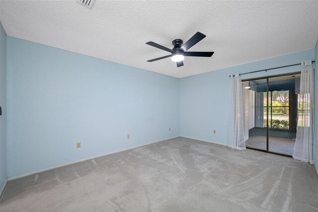70 Cypress Pl, Oldsmar, FL 34677 - carpeted spare room with a ceiling fan, a textured ceiling, and baseboards