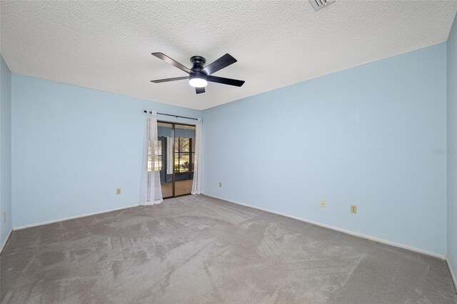 70 Cypress Pl, Oldsmar, FL 34677 - carpeted spare room featuring a ceiling fan, baseboards, and a textured ceiling