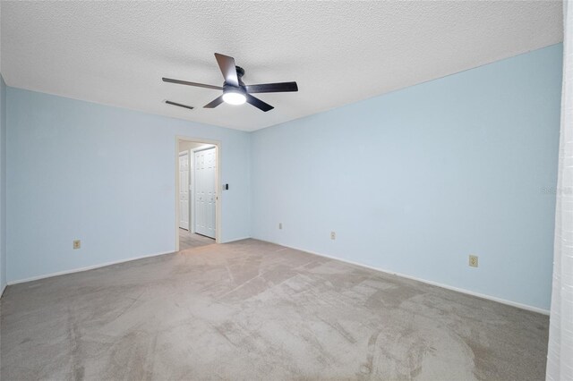 70 Cypress Pl, Oldsmar, FL 34677 - unfurnished room featuring carpet, a ceiling fan, and a textured ceiling