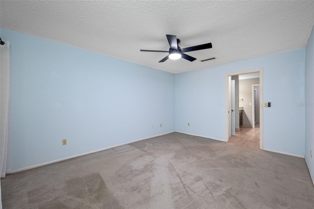 70 Cypress Pl, Oldsmar, FL 34677 - carpeted empty room featuring a ceiling fan, baseboards, and a textured ceiling