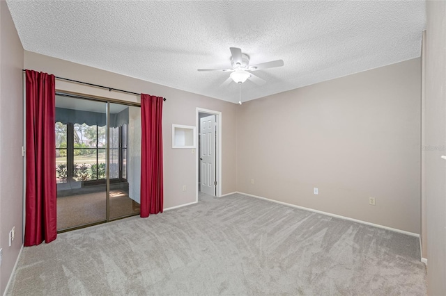 70 Cypress Pl, Oldsmar, FL 34677 - carpeted empty room with a ceiling fan, baseboards, and a textured ceiling