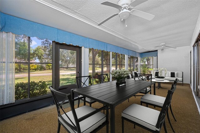 70 Cypress Pl, Oldsmar, FL 34677 - sunroom with a ceiling fan, a textured ceiling, outdoor dining area, and carpet flooring