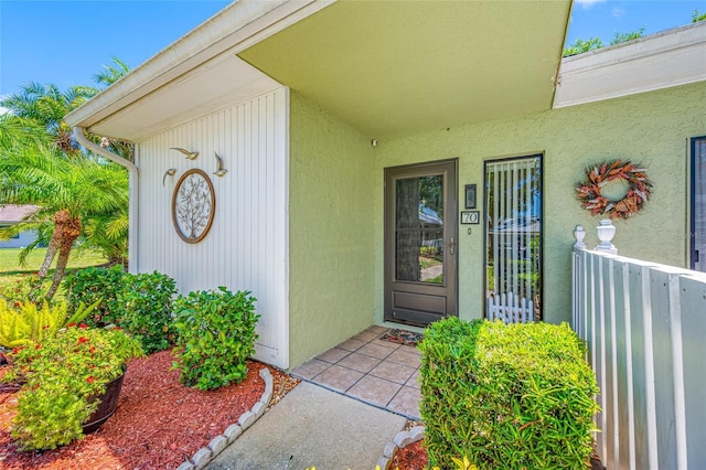 70 Cypress Pl, Oldsmar, FL 34677 - doorway to property with stucco siding